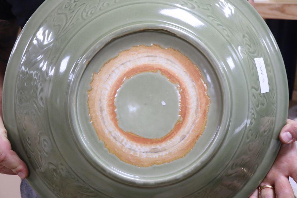 A Chinese celadon glazed bowl, Ming dynasty, diameter 43cm